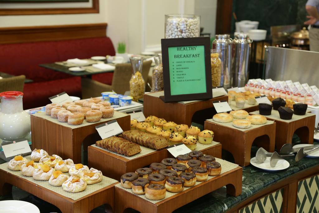 Eros Hotel New Delhi, Nehru Place Exteriör bild A selection of pastries at a buffet